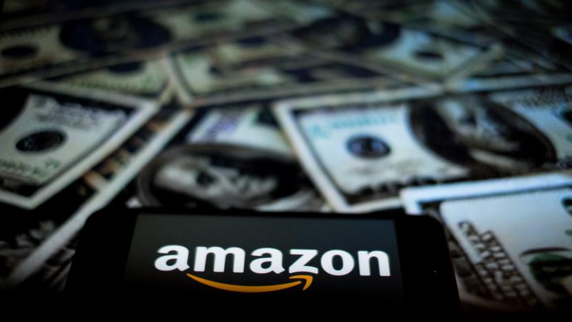 In this photographic illustration, the Amazon logo is displayed on the screen of a smartphone as a background to the Dollars on a computer person   on April 29, 2021 in Rome, Italy. (Photo by Andrea Ronchini/NurPhoto via Getty Images)