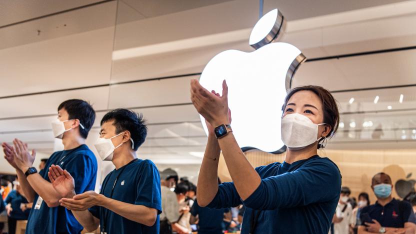 WUHAN, CHINA - 2022/05/21: Apple staff wearing masks welcome customers at the opening of a new store in Wuhan, China's Hubei province. Apple opened its first flagship store in Wuhan, also the 54th flagship store in Greater China. (Photo by Ren Yong/SOPA Images/LightRocket via Getty Images)