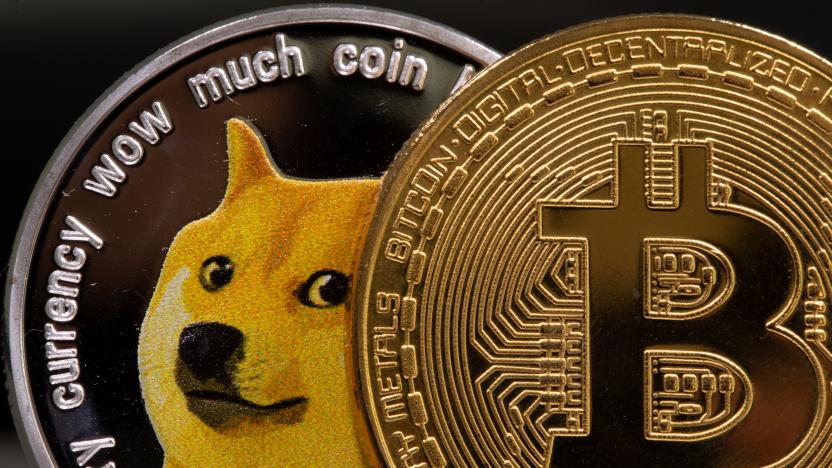 Representations of the virtual currency Dogecoin and Bitcoin are seen in this illustration taken June 16, 2021. REUTERS/Dado Ruvic/Illustration