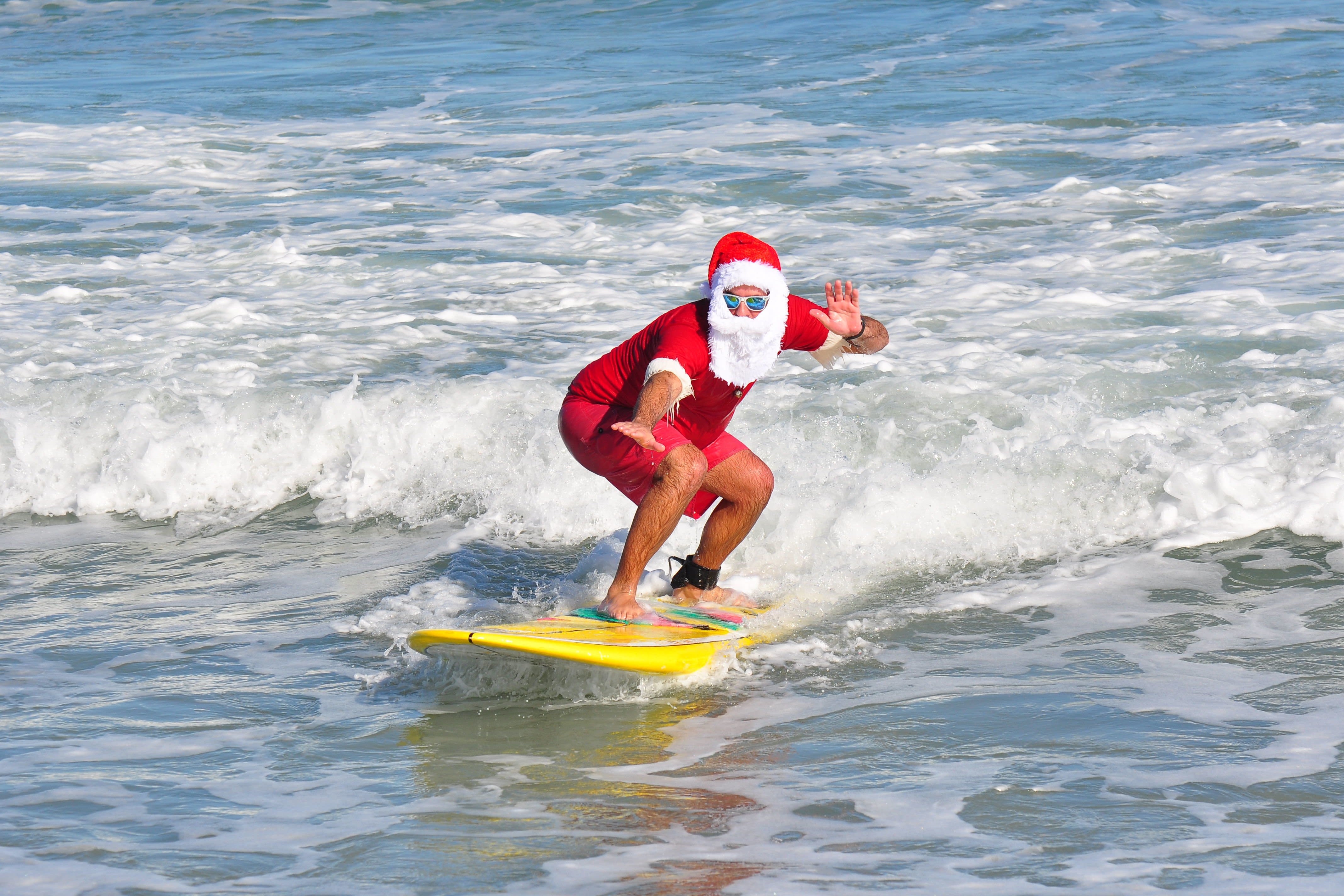 Celebrate Christmas Eve with Hundreds of Surfing Santas on Cocoa Beach