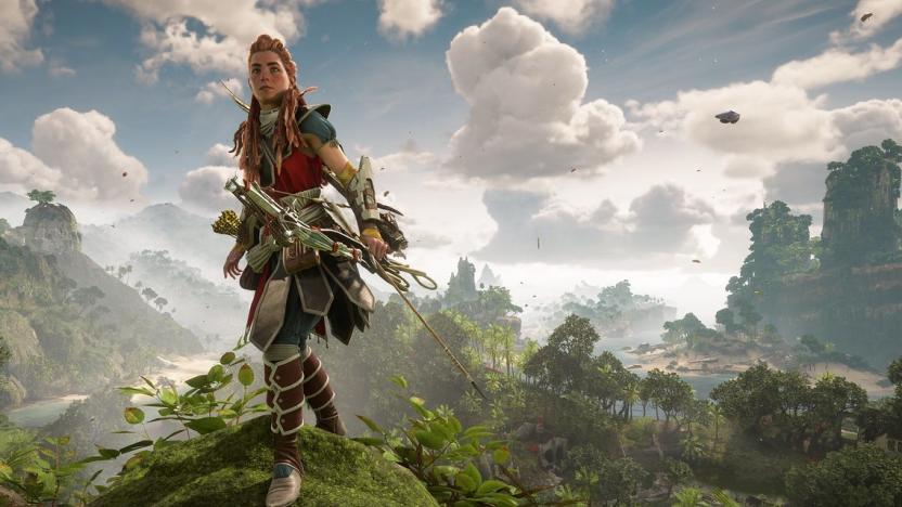 Aloy stands on a hill with lush vegetation behind her in Horizon Forbidden West.