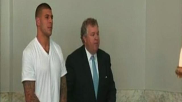 Hernandez Charged With Murder, Cut by Patriots