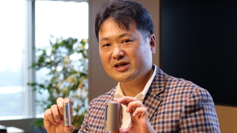 Kazuo Tadanobu, CEO of Panasonic's Energy Company holds a prototype of the 4680 format battery cell (R) next to the current 2170 battery supplied to Tesla Inc during a news conference in Tokyo, Japan October 25, 2021.REUTERS/Tim Kelly