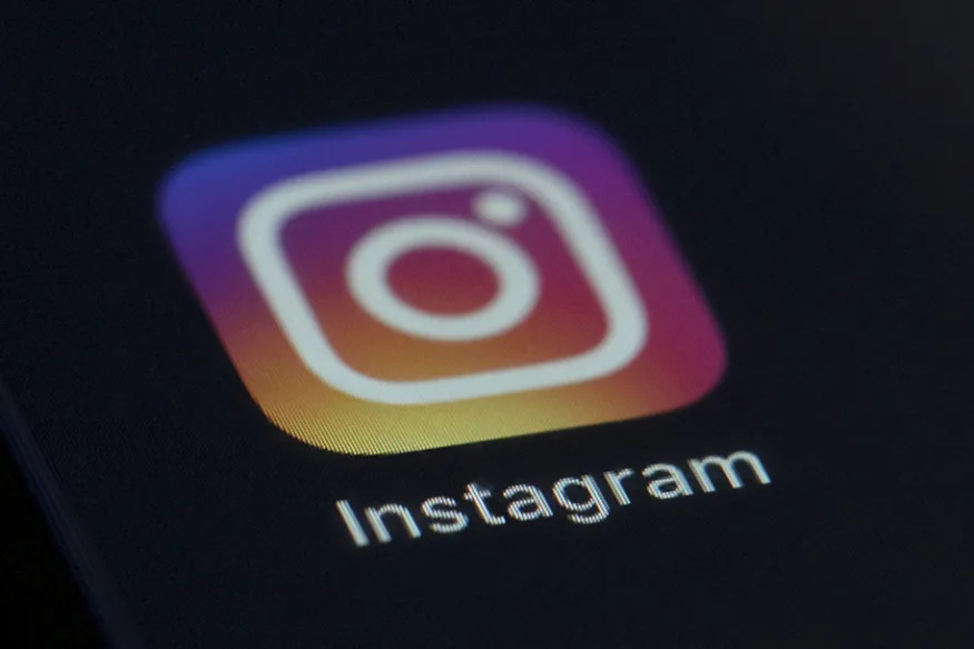 This Friday, Aug. 23, 2019 photo shows the Instagram app icon on the screen of a mobile device in New York. On Friday, Aug. 23, 2019, The Associated Press reported on stories circulating online incorrectly asserting that users must repost a message stating they do not give the platform or related entities permission to use “my pictures, information, messages or posts, both past and future,” to stop the platform from acquiring their photos. On Wednesday, Aug. 21, 2019, Stephanie Otway, Facebook company spokesperson said, “There’s no truth to this post.” (AP Photo/Jenny Kane)