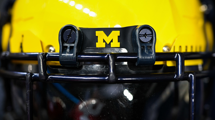 Getty Images - INDIANAPOLIS, IN - JULY 27: A Michigan Wolverines football helmet  during the Big Ten Conference Media Days on July 27, 2023 at Lucas Oil Stadium in Indianapolis, IN (Photo by James Black/Icon Sportswire via Getty Images)