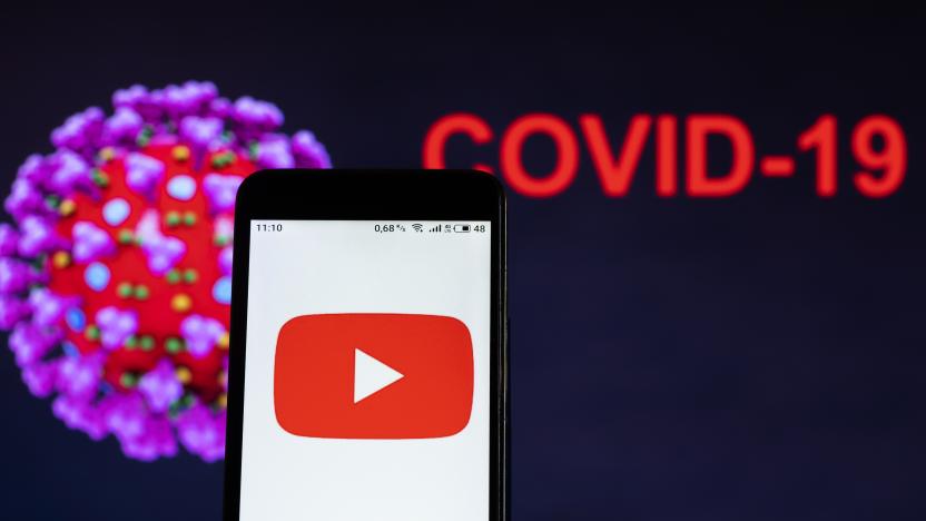 UKRAINE - 2020/12/18: In this photo illustration, a Youtube logo seen displayed on a smartphone with a computer model of the COVID-19 coronavirus in the background. (Photo Illustration by Igor Golovniov/SOPA Images/LightRocket via Getty Images)