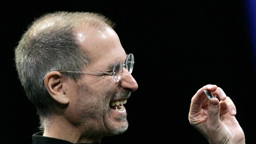 Apple CEO Steve Jobs shows the new Intel "Core 2 Duo" chip used in the MacBook Air during the Macworld Convention and Expo in San Francisco January 15, 2008.     REUTERS/Robert Galbraith (UNITED STATES)