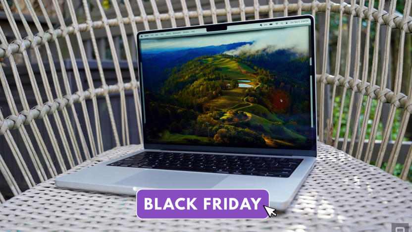 The new MacBook Pro with an M3 chip sits on a rattan chair outside. 