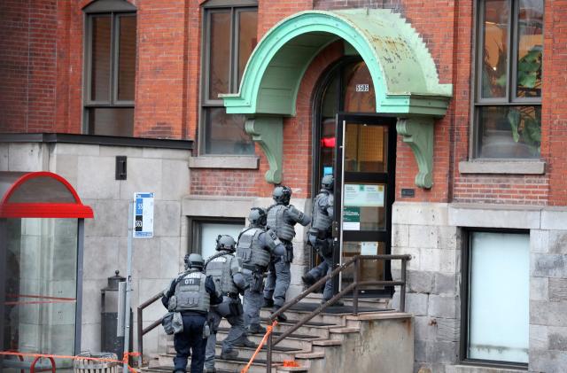 Police enter the offices of gaming software developer Ubisoft during a police security operation in Montreal, Quebec, Canada November 13, 2020.  REUTERS/Christinne Muschi