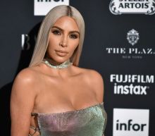 Kim Kardashian clears up rumors that she and Kanye West aren't having twins