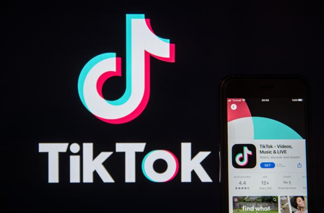 TURKEY - 2023/05/18: In this photo illustration, a TikTok logo seen displayed on a smartphone screen. (Photo Illustration by Onur Dogman/SOPA Images/LightRocket via Getty Images)