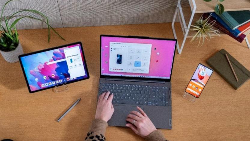 A Lenovo ThinkPad next to a tablet and smartphone. 