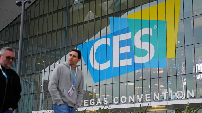 People walk by the Las Vegas Convention Center during setup ahead of the CES tech show Saturday, Jan. 6, 2024, in Las Vegas.