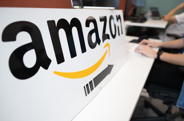 14 September 2023, Saxony, Dresden: An Amazon software developer sits at a desk during a press event at the online retailer's research and development site. Amazon is celebrating its tenth anniversary in Dresden. Photo: Sebastian Kahnert/dpa (Photo by Sebastian Kahnert/picture alliance via Getty Images)