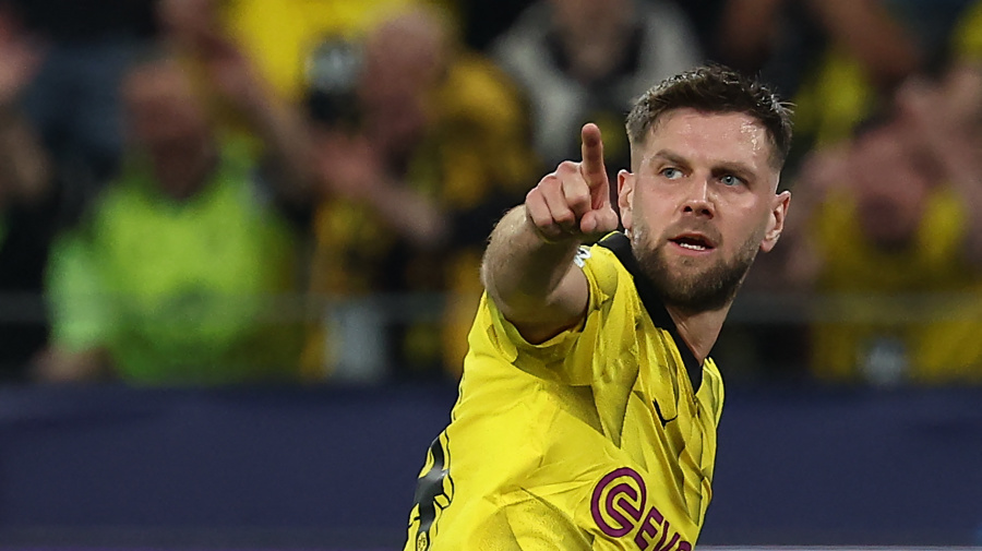 Getty Images - Dortmund's German forward #14 Niclas Fuellkrug celebrates after scoring a goal during the UEFA Champions League semi-final first leg football match between Borussia Dortmund and Paris Saint-Germain (PSG) in Dortmund, western Germany on May 1, 2024. (Photo by FRANCK FIFE / AFP) (Photo by FRANCK FIFE/AFP via Getty Images)