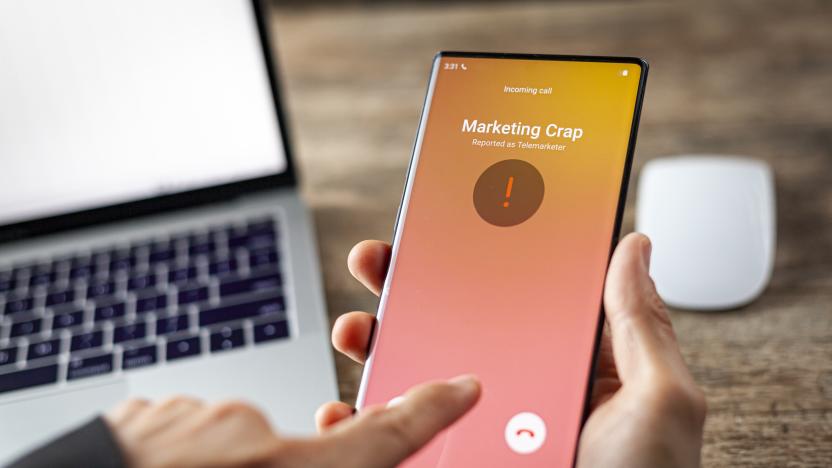 Concept image showing an office setting where a professional is receiving an unwanted robocall on her phone. The network provider detect the scam and put marketing crap notice. woman rejects the call.