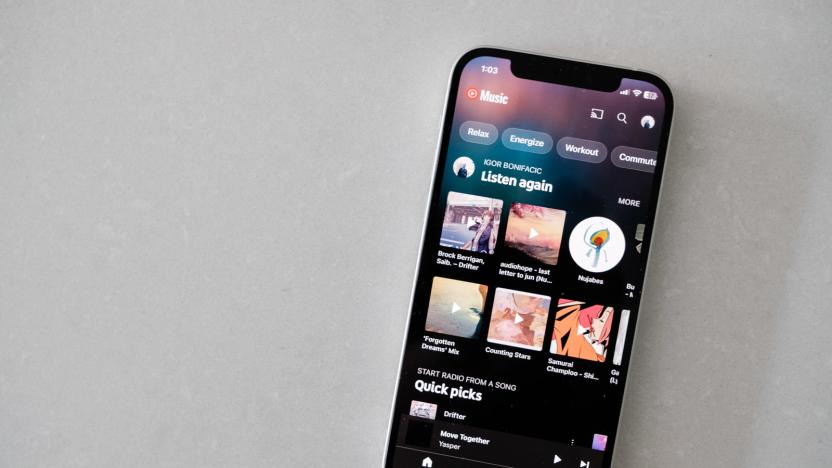 Photo of YouTube Music's iPhone app, against a marble counter. 