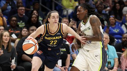 Getty Images - ARLINGTON, TEXAS - MAY 03: Caitlin Clark #22 of the Indiana Fever drives to the basket against the Dallas Wings during the first quarter in the preseason game at College Park Center on May 03, 2024 in Arlington, Texas.  (Photo by Gregory Shamus/Getty Images)