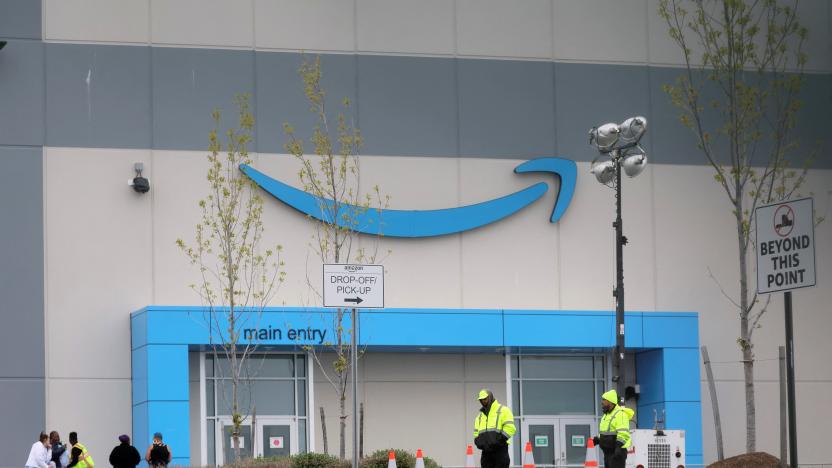 Security personnel are seen as Amazon workers gather outside Amazon’s LDJ5 sortation center, as employees begin voting to unionize a second warehouse in the Staten Island borough of New York City, U.S. April 25, 2022. REUTERS/Brendan McDermid.