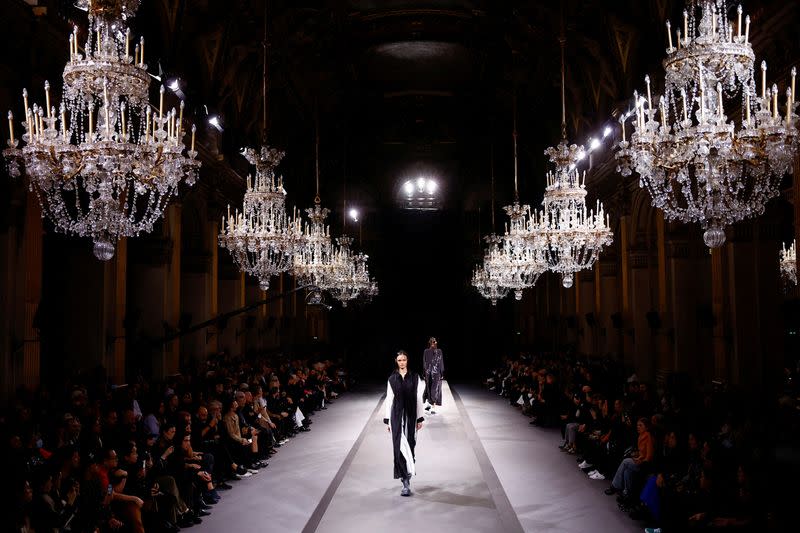 Under a cloud of belt tightening, Paris Fashion Week struts around
