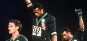 Tommie Smith, center, and John Carlos raise their fists in protest at the 1968 Olympics. (AP)