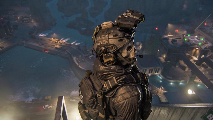 A game character in Call of Duty Modern Warfare III is seen slightly from above as they're completely suited in military gear. Slightly blurred roads and buildings are seen in the lower distance and it appears to be dusk or nighttime. 