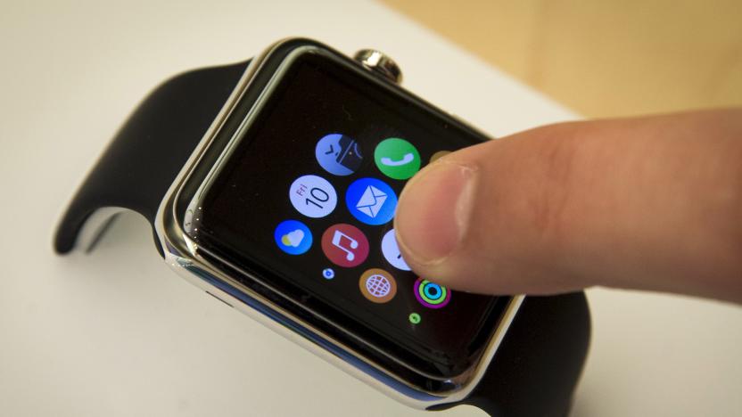 A customer touches the screen on the new Apple Watch displayed at an Apple Store in New York April 10, 2015.   REUTERS/Mike Segar