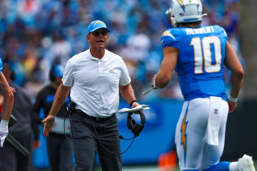 Jim Harbaugh's Chargers start rewriting record book in rout of Panthers