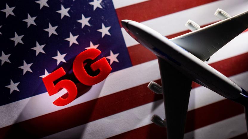 5G words and an airplane toy are placed on a printed U.S. flag in this illustration taken January 18, 2022. REUTERS/Dado Ruvic/Illustration