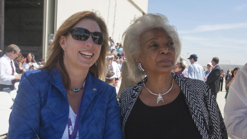 NASA Deputy Administrator Lori Garver (L) and actress Nichelle Nichols from the science fiction television show Star Trek look to the sky as they wait for space shuttle Endeavour prior to its arrival, at Los Angeles International Airport September 21, 2012. Endeavour touched down in Los Angeles on Friday on the back of a jumbo jet, greeted by cheering crowds as it ended a celebratory final flight en route to its retirement home at a Southern California science museum. The 75-ton winged spaceship, ferried by a modified Boeing 747, landed at Los Angeles International Airport after hop-scotching across the country from Cape Canaveral, Florida, and flying a victory lap over California. Endeavour will next undergo preparations to be moved through city streets to the California Science Center in downtown Los Angeles, where it will be put on display starting October 30. REUTERS/Paul E. Alers/NASA/Handout (UNITED STATES - Tags: SCIENCE TECHNOLOGY TRANSPORT ENTERTAINMENT) MANDATORY CREDIT. FOR EDITORIAL USE ONLY. NOT FOR SALE FOR MARKETING OR ADVERTISING CAMPAIGNS. THIS IMAGE HAS BEEN SUPPLIED BY A THIRD PARTY. IT IS DISTRIBUTED, EXACTLY AS RECEIVED BY REUTERS, AS A SERVICE TO CLIENTS