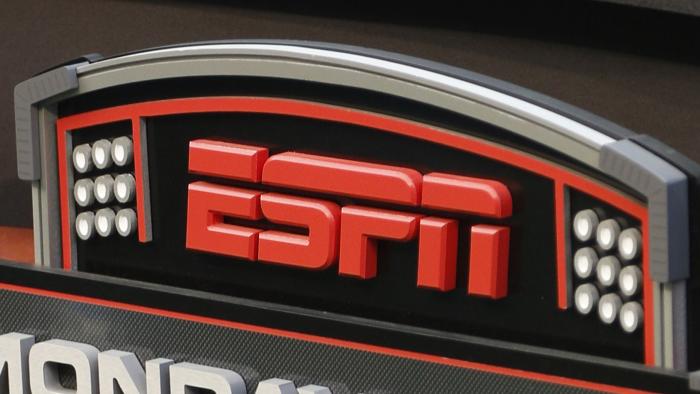 FILE - The ESPN logo is seen prior to an NFL football game between the Cincinnati Bengals and the Pittsburgh Steelers, Sept. 16, 2013, in Cincinnati. Hours before the fall's first “Monday Night Football” game, Disney and Charter Communications have settled a business dispute that had left some 15 million cable TV customers without ESPN and other Disney channels. Disney said that because of the deal, the majority of its ESPN customers would have service restored to Charter's Spectrum cable system right away. Charter confirmed the deal Monday, Sept. 11, 2023. (AP Photo/David Kohl, File)