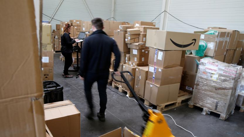 An employee prepares an order for Amazon at Porona warehouse in Bruay-sur-l'Escaut near Valenciennes, France, April 22, 2020. Picture taken, April 22, 2020.  REUTERS/Pascal Rossignol