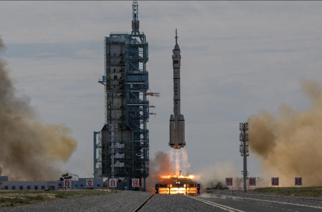 JIUQUAN, CHINA - JUNE 17: The manned Shenzhou-12 spacecraft from China's Manned Space Agency onboard the Long March-2F rocket launches with three Chinese astronauts onboard at the Jiuquan Satellite Launch Center on June 17, 2021 in Jiuquan, Gansu province, China. The crew of the Shenzhou-12 spacecraft will be carried on the Long March-2F rocket launched to the space station China is building from the Gobi Desert marking the country's first manned mission in nearly five years. (Photo by Kevin Frayer/Getty Images)