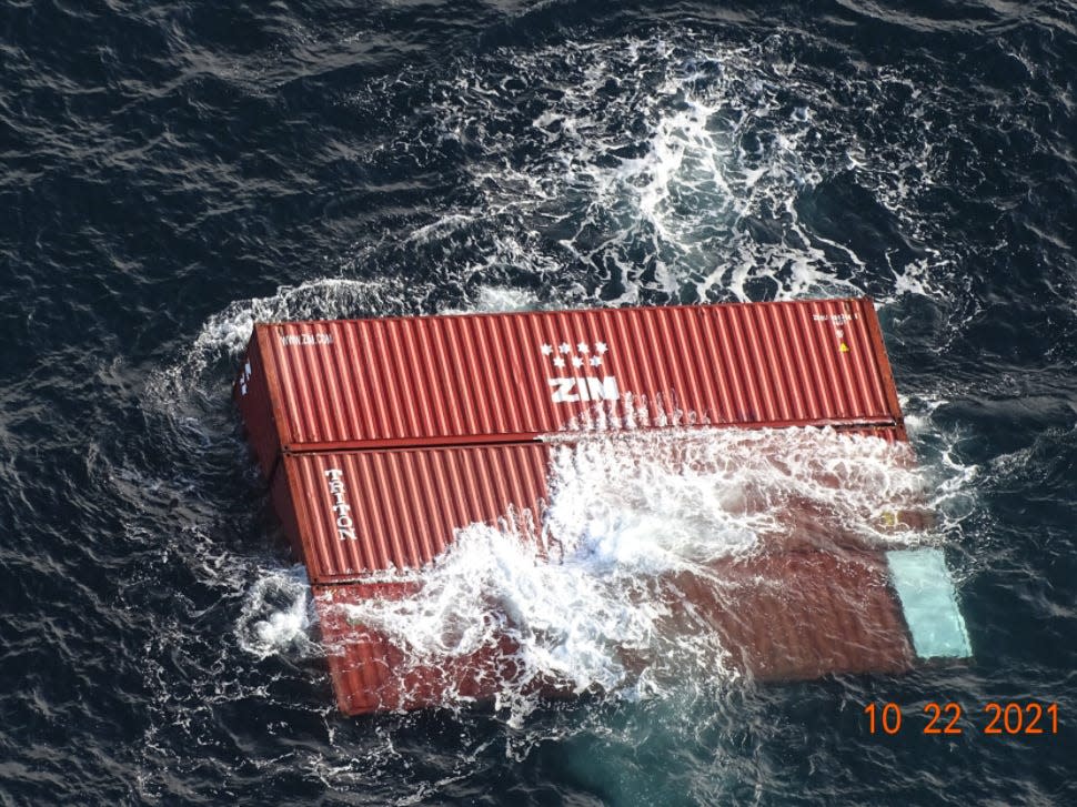 A fire broke out on a cargo ship after about 40 shipping containers fell overboard due to rough seas off the coast of Vancouver Island