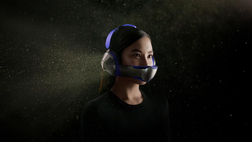 A person wearing the Dyson Zone headphone and mask combo, with a purple headband and silver/grey earcups. The graphic shows what look like dust particles surrounding the headphones.