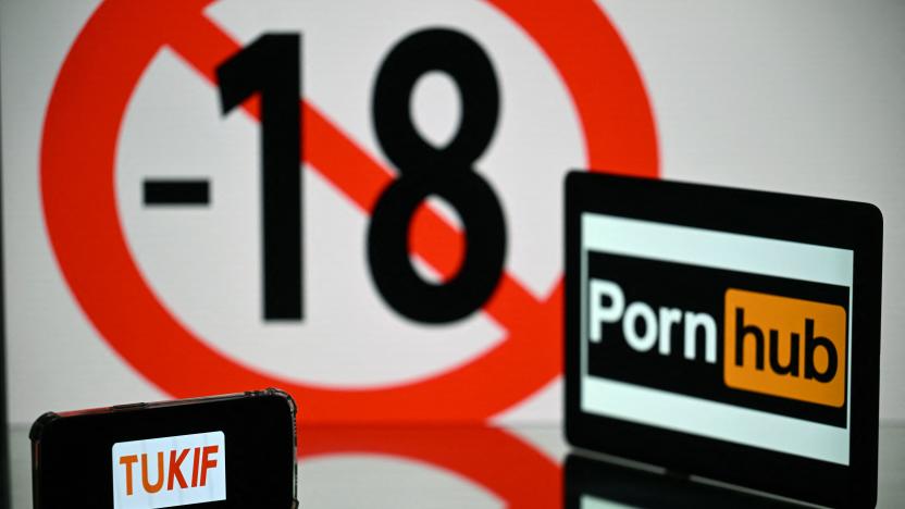 This photograph taken in Toulouse, southern France, shows screens displaying an age restriction warning sign and the logos of the pornographic sites Pornhub (R) and Tukif (L), on May 24, 2022. - The judicial examination of Arcom request against porn sites has been postponed to one month, on May 24, 2022. Arcom media regulator requests five pornographic sites to be blocked as they are not preventing the exposure of minors to their content, and French telecom operators to block access to the pornographic sites. (Photo by Lionel BONAVENTURE / AFP) (Photo by LIONEL BONAVENTURE/AFP via Getty Images)