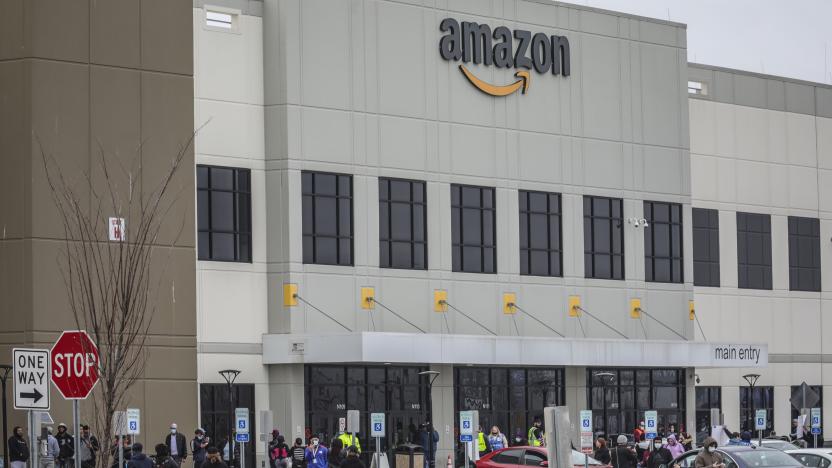 Workers at Amazon's fulfillment center in Staten Island, N.Y., gather outside to protest work conditions in the company's warehouse, Monday March 30, 2020, in New York. Workers say Amazon is not doing enough to to keep workers safe from the spread of COVID-19 and coronavirus. (AP Photo/Bebeto Matthews)