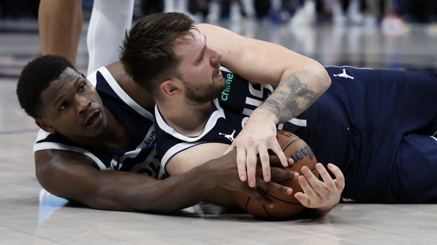 Getty Images - DALLAS, TEXAS - MAY 26: Anthony Edwards #5 of the Minnesota Timberwolves and Luka Doncic #77 of the Dallas Mavericks battle for a loose ball during the fourth quarter in Game Three of the Western Conference Finals at American Airlines Center on May 26, 2024 in Dallas, Texas. NOTE TO USER: User expressly acknowledges and agrees that, by downloading and or using this photograph, User is consenting to the terms and conditions of the Getty Images License Agreement. (Photo by Matthew Stockman/Getty Images)