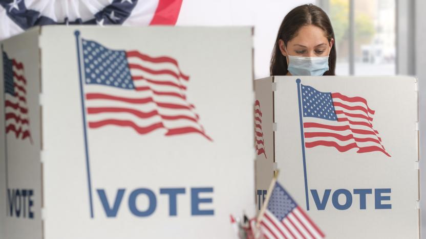 Woman in face mask voting
