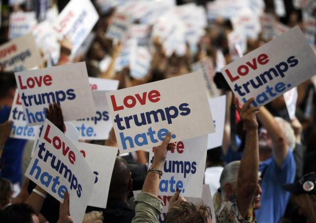 Delegates hold anti-Donald Trump signs during the Democratic convention in Philadelphia. (Photo: Gary Cameron/Reuters)