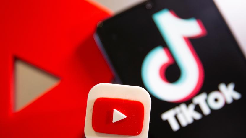 A 3D printed Youtube and Tik Tok logo are seen near smartphone with displayed Tik Tok logo in this illustration taken, September 15, 2020. REUTERS/Dado Ruvic/Illustration