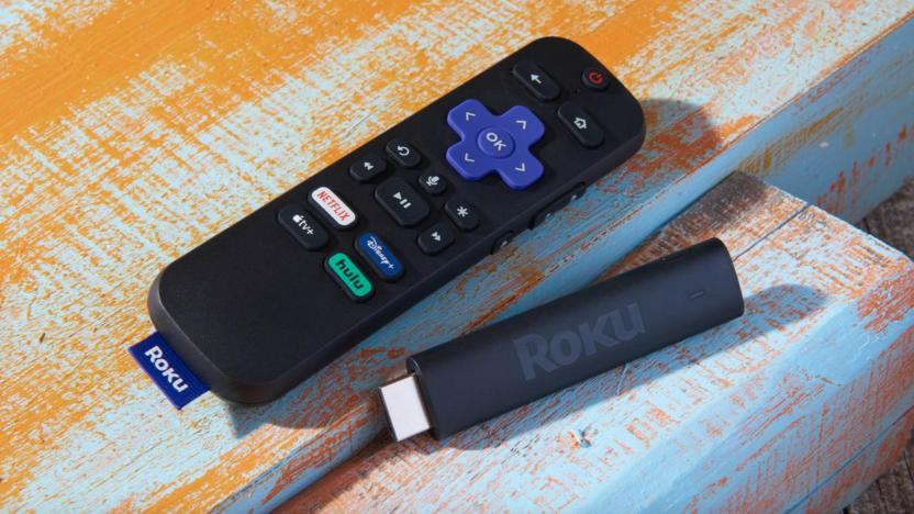 A streaming stick and a remote on a table.