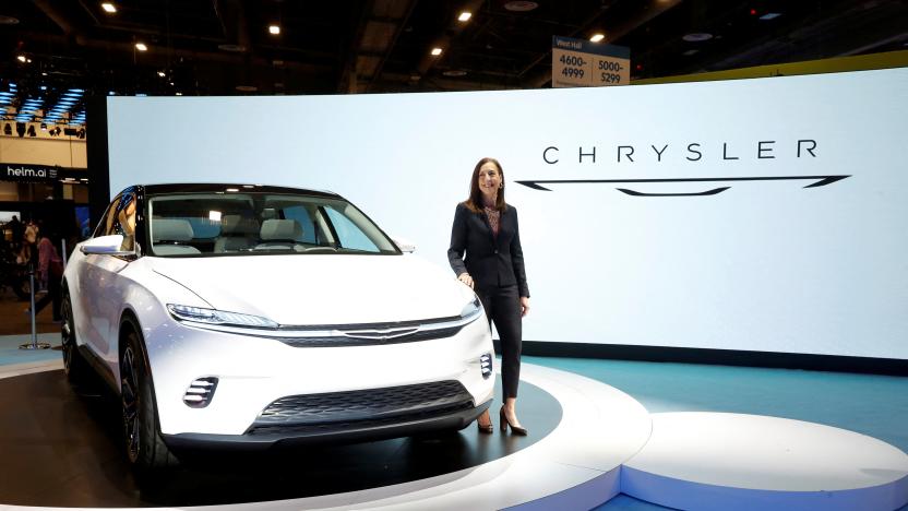 Chrysler CEO Christine Feuell poses by the Chrysler Airflow Concept electric vehicle during CES 2022 at the Las Vegas Convention Center in Las Vegas, Nevada, U.S. January 5, 2022. REUTERS/Steve Marcus