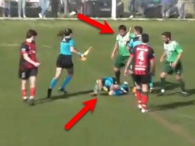 A soccer player was arrested on the field after sucker-punching a woman ref over..