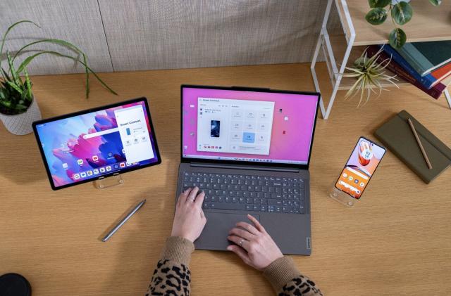 A tablet, laptop, and smartphone using Lenovo and Motorola's Smart Connect