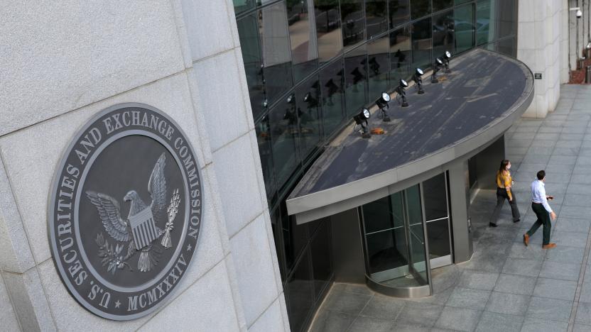 People exit the headquarters of the U.S. Securities and Exchange Commission (SEC) in Washington, D.C., U.S., May 12, 2021. Picture taken May 12, 2021. REUTERS/Andrew Kelly