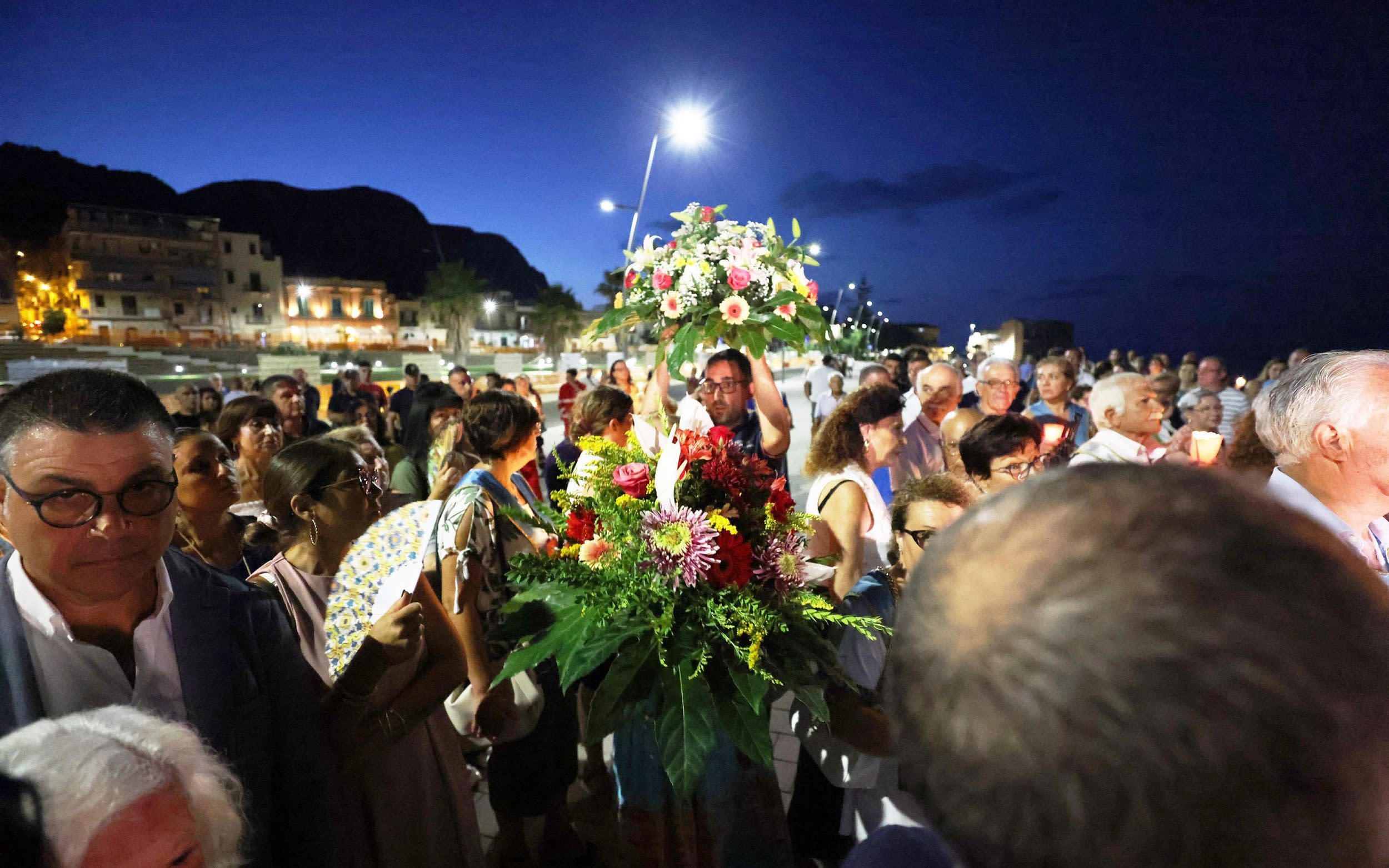 Hundreds gather at candlelit vigil for victims of Bayesian yacht sinking