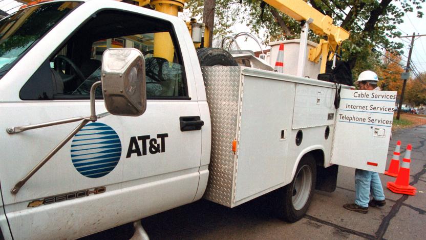 380909 01: An AT&T advance-line technician parks his service truck October 26, 2000 as he prepares to troubleshoot an aerial cable in Des Plaines, Illinois. On October 25, 2000, AT&T Corp. announced that it was breaking itself up into four smaller companies for the third time since 1984, scrapping its vision of one-stop shopping for communications services, and dismantling a telephone and cable TV empire that took three years and more than $100 billion to build. The widely expected breakup will create four distinct entities, including an independent cable company and an independent wireless company, all operating under the AT&T brand name. (Photo by Tim Boyle/Newsmakers)