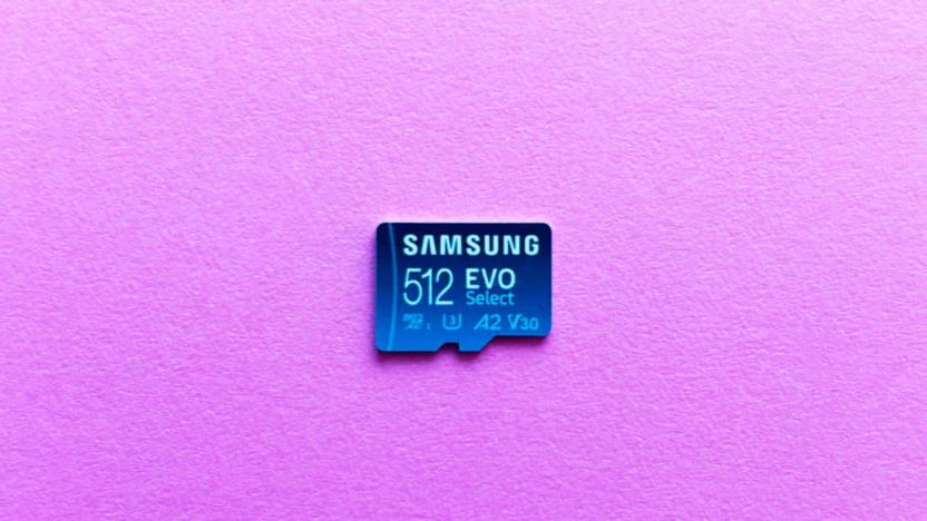 A light blue microSD card, the Samsung Evo Select, rest against a pink background.  