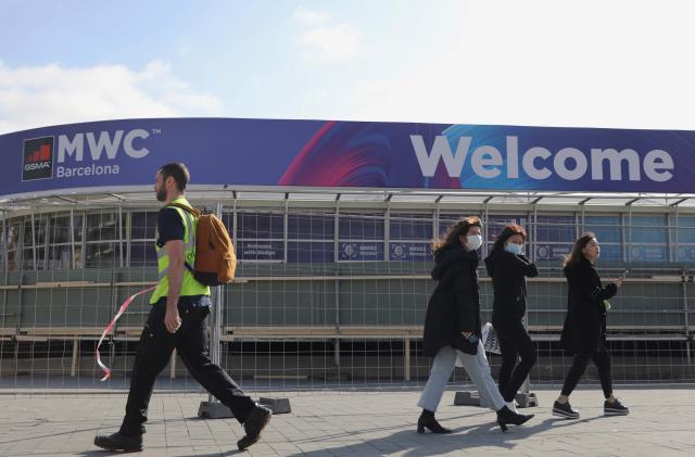 Employees pass by Fira de Barcelona after the Mobile World Congress (MWC) was cancelled in Barcelona, Spain February 13, 2020. REUTERS/Nacho Doce